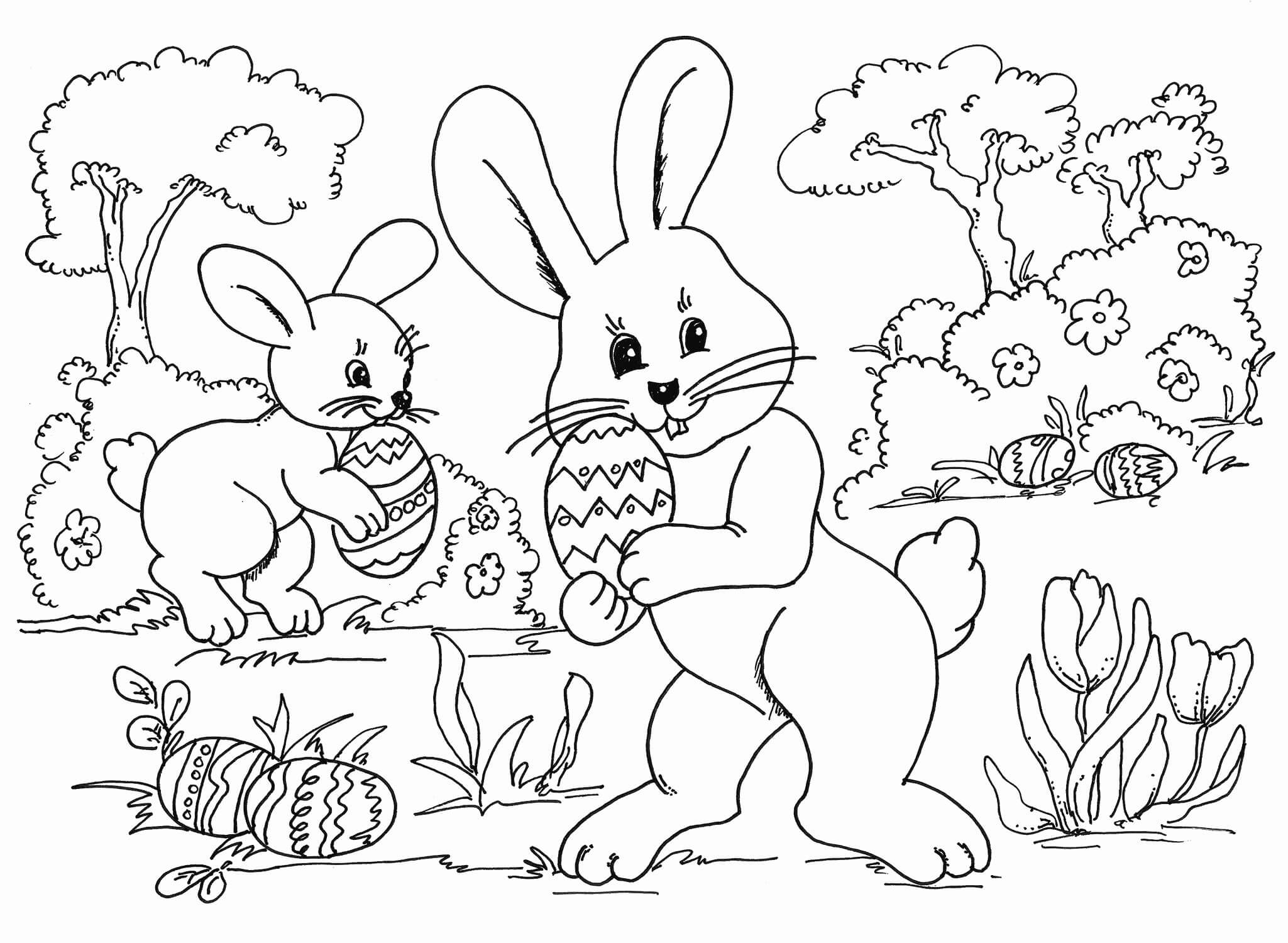 Desenhos de Dois Coelhinhos com ovo de Páscoa para colorir