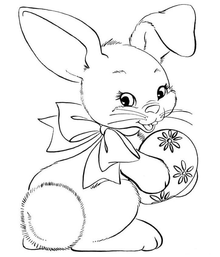 Desenhos de Coelho Segurando ovo de Páscoa para colorir