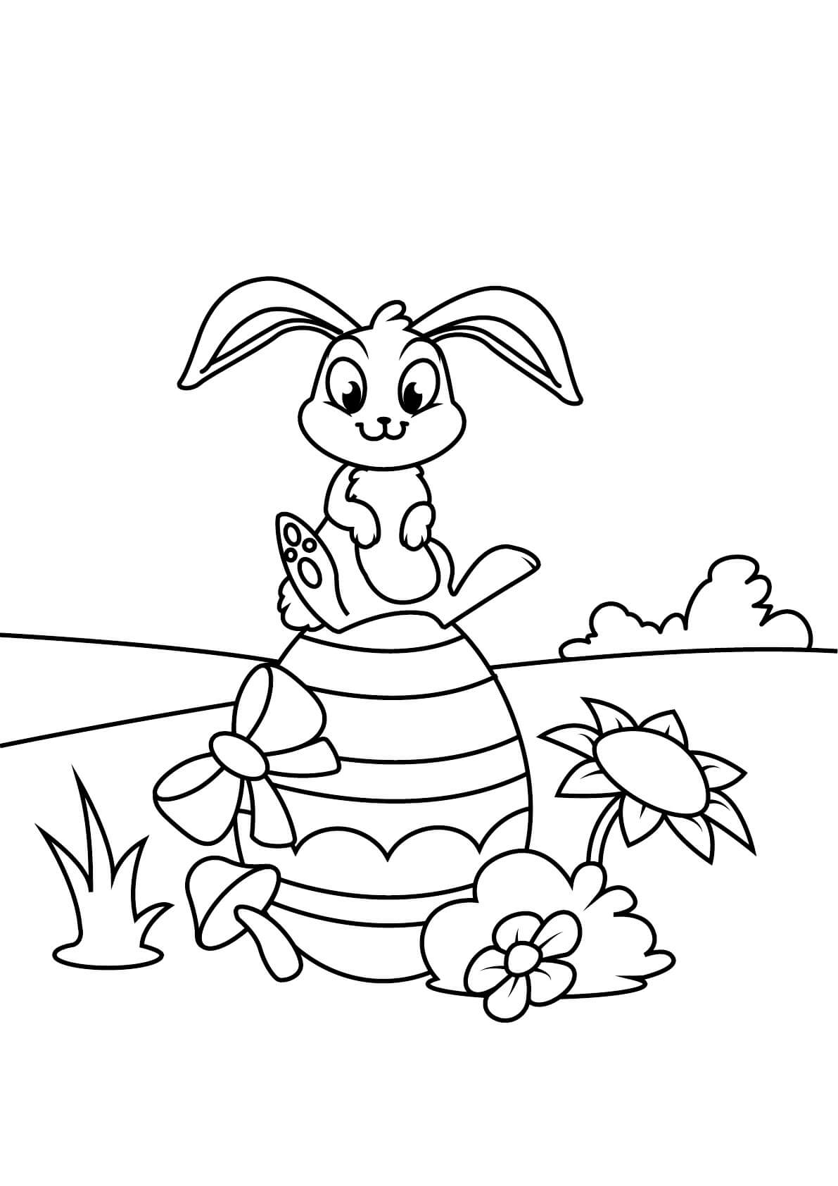 Coelho sentado no ovo de Páscoa para colorir