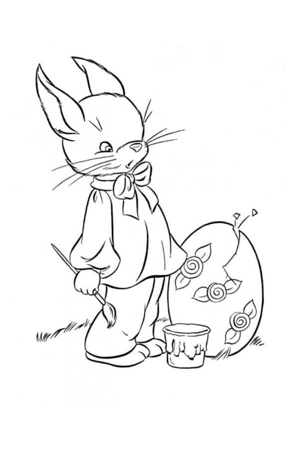 Cartoon Bunny Paints Easter Eggs coloring page