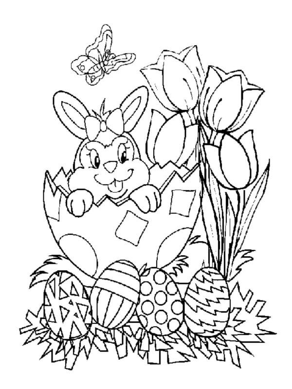 Happy Bunny In a Bow Peeks Out Of An Egg To Admire A Bouquet Of Tulips